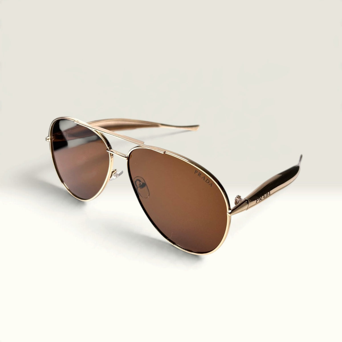 Prada PR 54ZS Pale Gold frame with Brown lenses