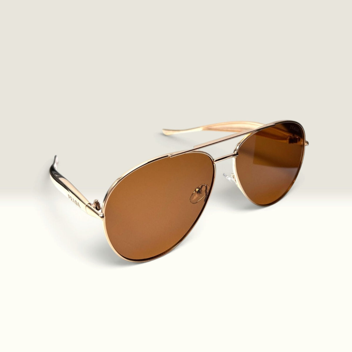 Prada PR 54ZS Pale Gold frame with Brown lenses