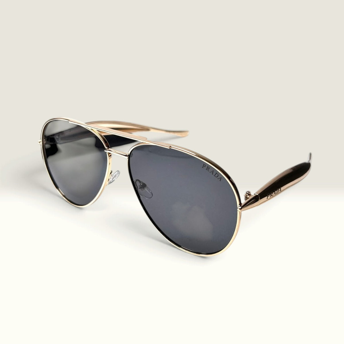 Prada PR 54ZS Pale Gold frame with Dark Gray lenses