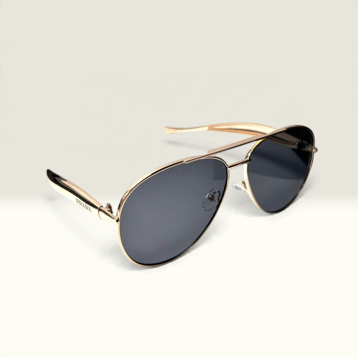 Prada PR 54ZS Pale Gold frame with Dark Gray lenses