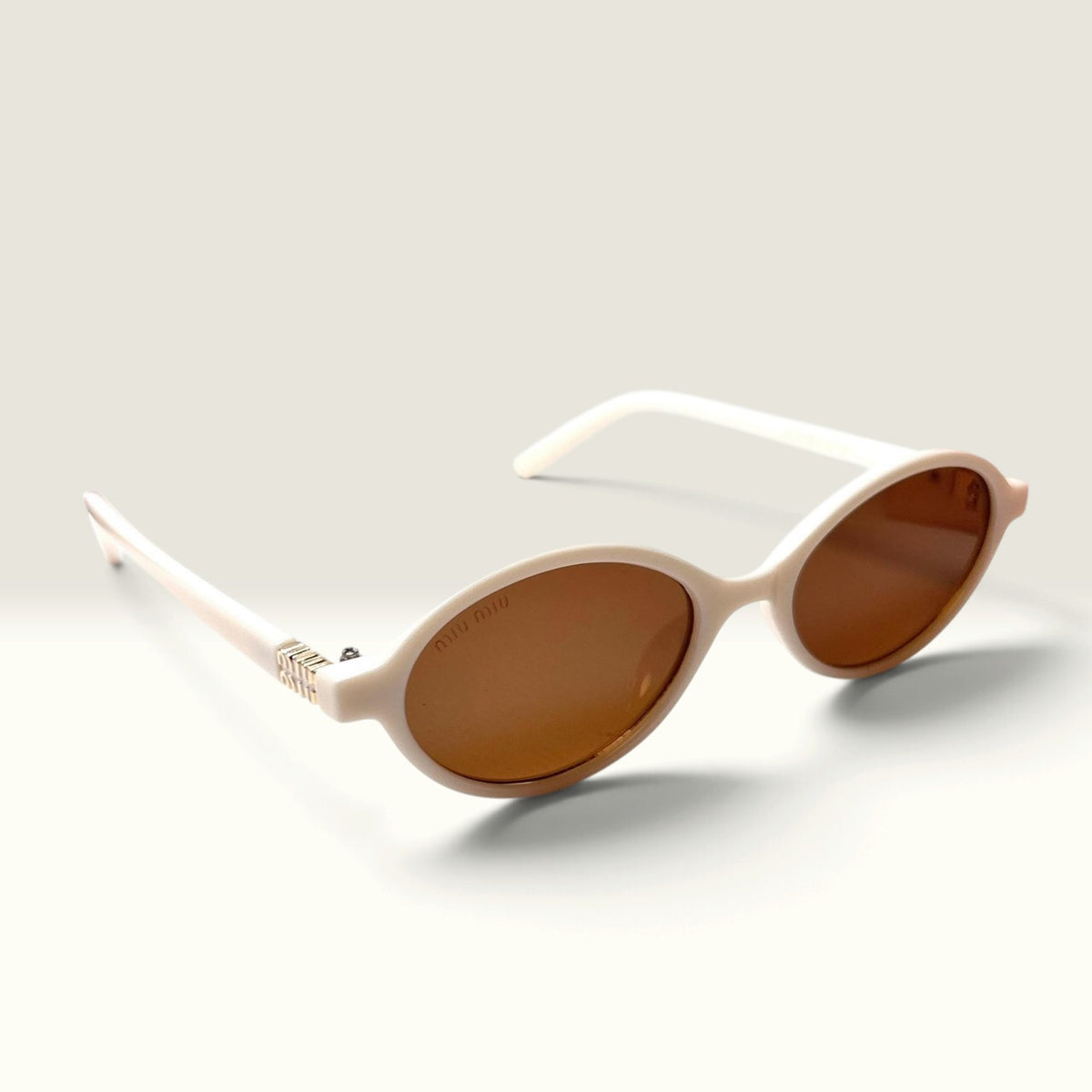 Miu Miu MU 04ZS "Miu Regard" Oval Ivory Chalk White